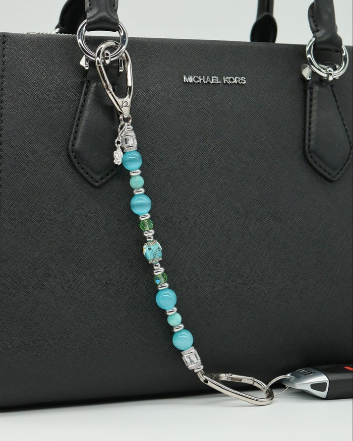 LD Keyfinder Azure Meadow beaded keychain with aqua blue, green Amazonite, cat's eye beads, and daisy charm.