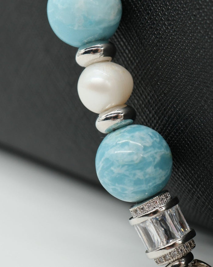 LD Keyfinder Beachy Dreams bracelet with teal, blue, and white glass beads, freshwater pearls, and silver spacers.