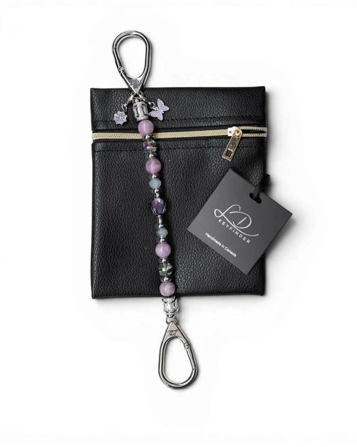 LD Keyfinder Blooming Joy beaded keychain with Lepidolite, Jade, glass tulip, and charms on a black leather pouch.