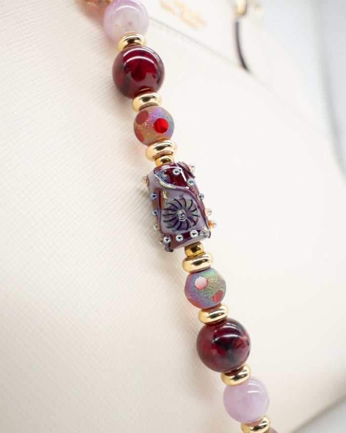LD Keyfinder Bordeaux Bloom beaded accessory with burgundy agate, lavender kunzite, artisan glass, and gold accents.