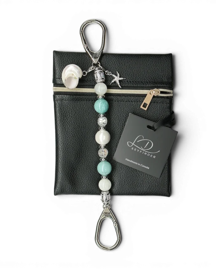 LD Keyfinder Caribbean Pearl beaded keychain with aqua jade, moonstone, shell pearl, and starfish charm on black pouch