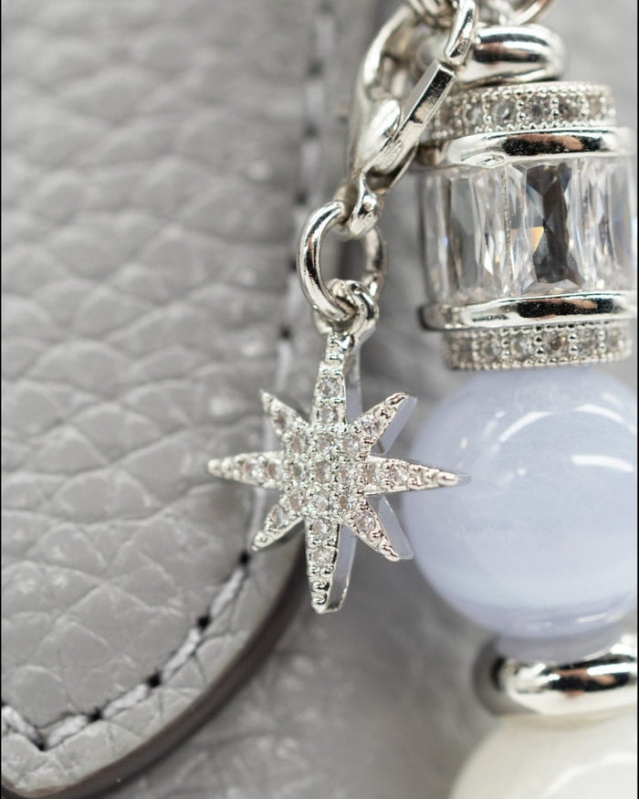 LD Keyfinder Cloud Dancer accessory featuring a pavé star charm, blue lace agate, and platinum-plated baguette beads.