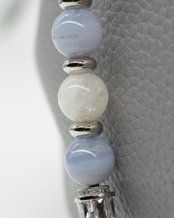 LD Keyfinder Cloud Dancer beaded accessory with blue lace agate, rainbow moonstone, and platinum-plated accents.