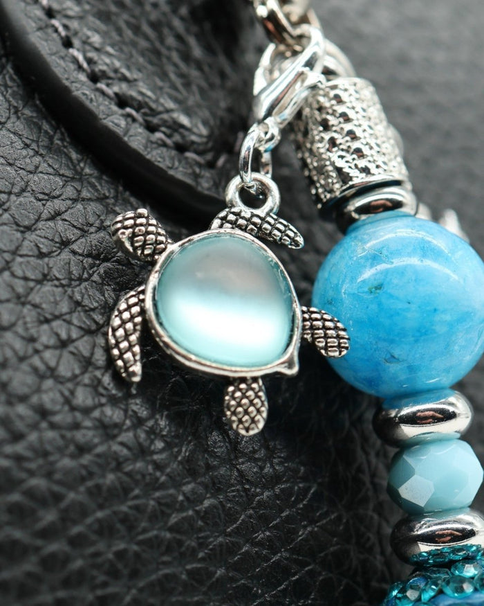 Silver plated aqua glass sea turtle charm