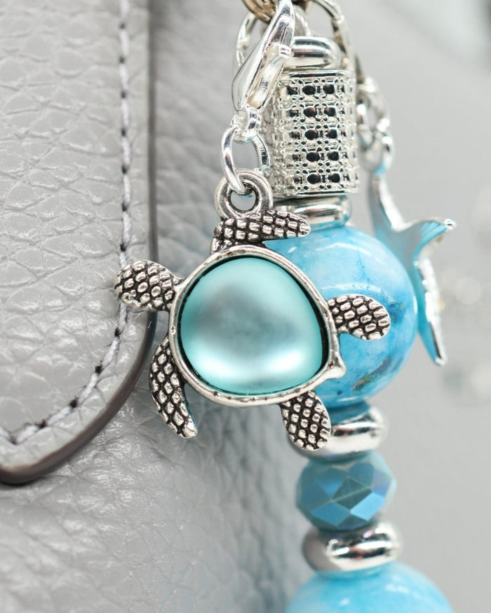 Silver plated aqua glass sea turtle charm