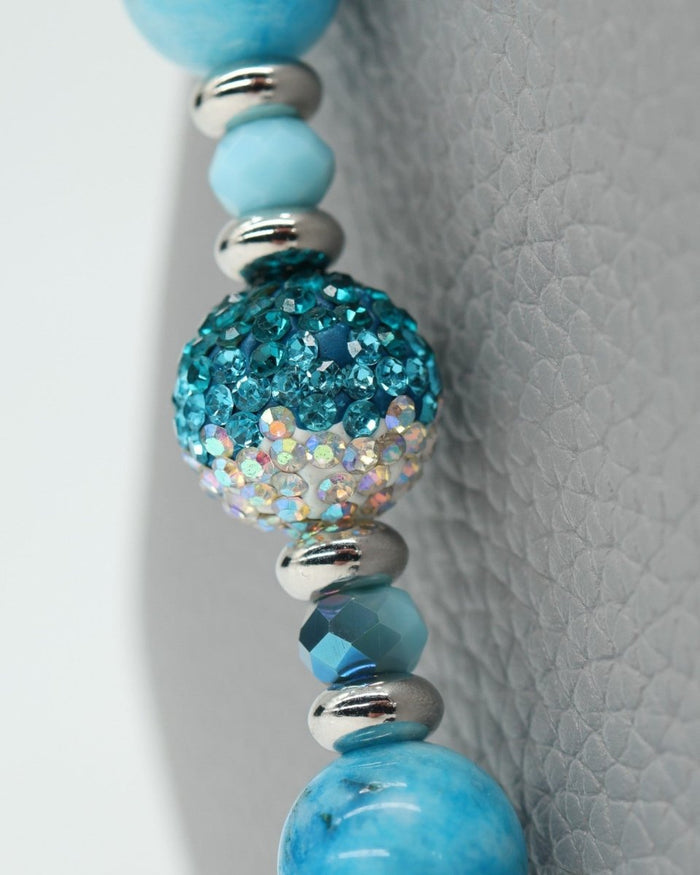 LD Keyfinder Coastal Tide bracelet with aqua hemimorphite beads, Austrian crystal, and silver charms.