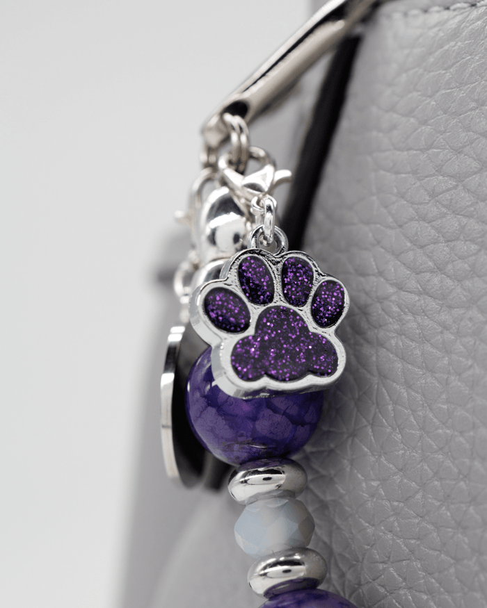 Purple sparkling dog paw charm