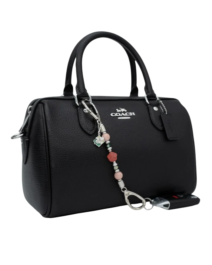 LD Keyfinder Garden Bliss-Mini accessory with pink opal, cherry quartz flower, and green beads on a black handbag