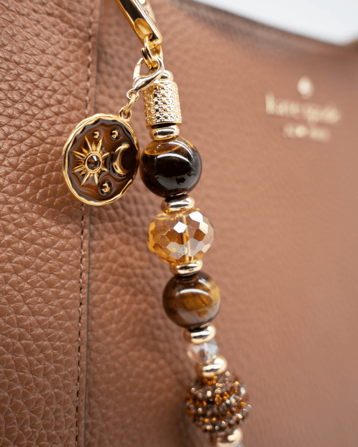 LD Keyfinder Golden Equinox beaded key chain with Tiger Eye, faceted crystals, and a gold sun and moon charm.