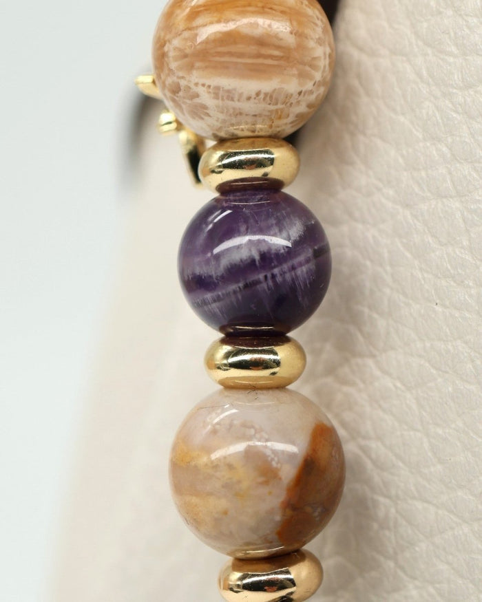 LD Keyfinder Golden Nebula: handcrafted artisan glass bead with purple & gold swirls, fossil coral, amethyst, gold-plated spacers, rhinestone & star charm.