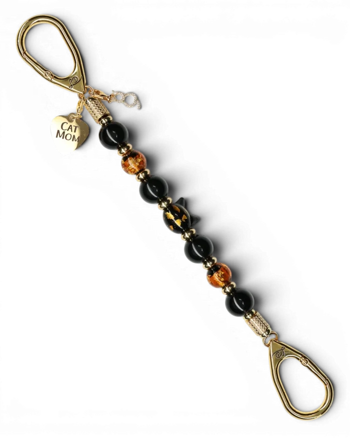LD Keyfinder Golden Purrs beaded keychain with black obsidian, gold foil lampwork glass, and a Cat Mom heart charm.