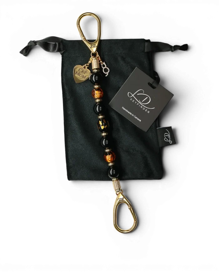 LD Keyfinder Golden Purrs beaded keychain with black obsidian, gold foil lampwork glass, and Cat Mom heart charm.