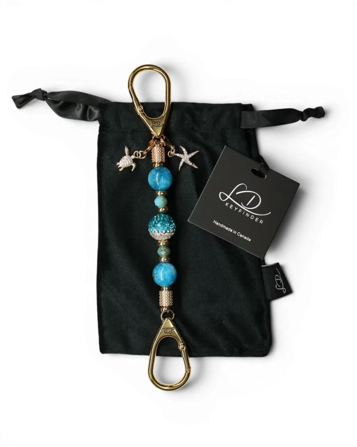 LD Keyfinder Golden Reef Mini keychain with aqua hemimorphite beads, crystal center, starfish & turtle charms, 18k gold plating.