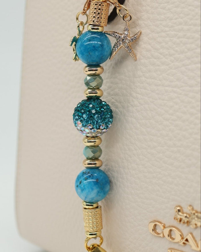 LD Keyfinder Golden Reef Mini charm with aqua hemimorphite beads, crystal bead, starfish and sea turtle charms, gold hardware.