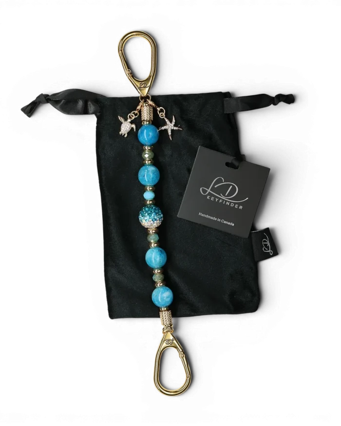 LD Keyfinder Golden Reef keychain with aqua hemimorphite beads, crystal center bead, starfish and turtle charms, gold-plated hardware.