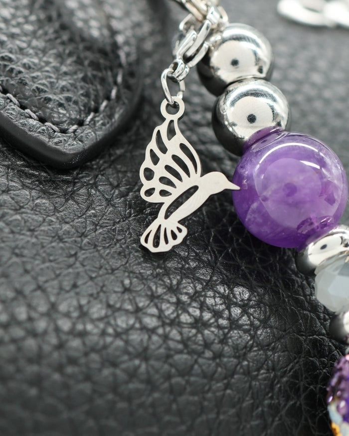 Polished stainless hummingbird charm