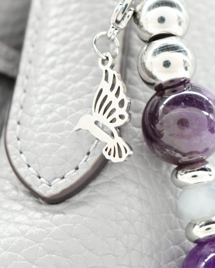 Polished stainless hummingbird charm