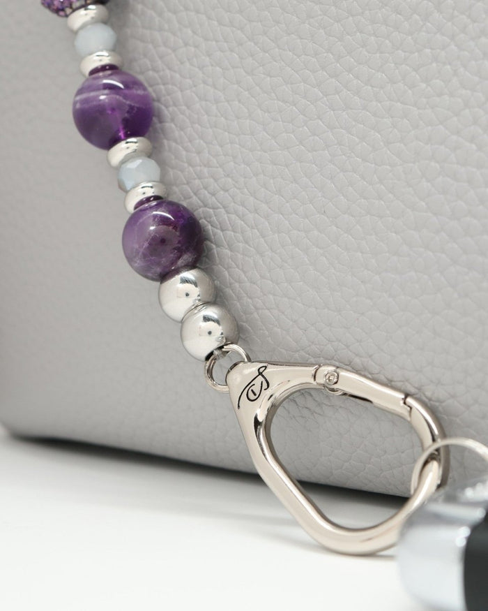 LD Keyfinder Hummingbird Dream bracelet with amethyst, crystal daisy bead, and silver charm.