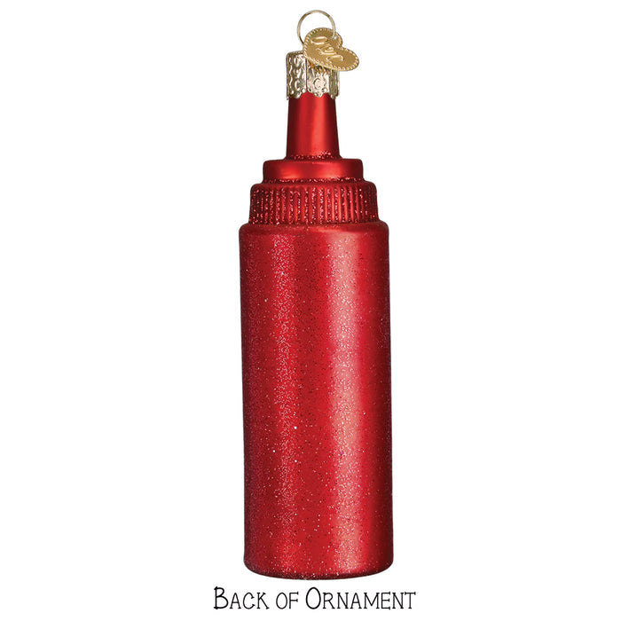 Red ketchup bottle-shaped Christmas ornament on a white background back view