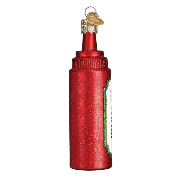Red glass ketchup bottle ornament on a white background