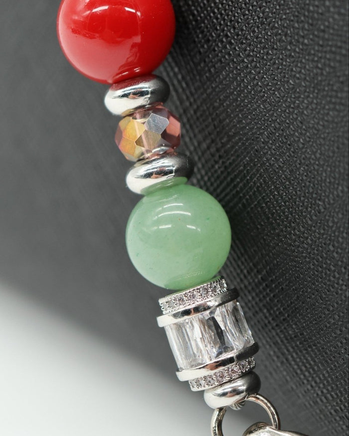 LD Keyfinder Ladybug Love beaded accessory with red shell pearl, green aventurine, and baguette rhinestone accents.