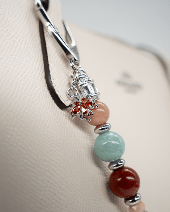 LD Keyfinder Maple Majesty accessory featuring red jasper, jade, and moonstone beads with a maple leaf and squirrel charm