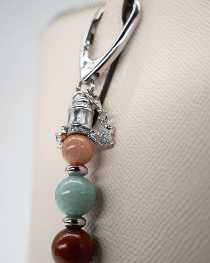 LD Keyfinder Maple Majesty accessory featuring gemstone beads, a squirrel charm, and platinum-plated accents.
