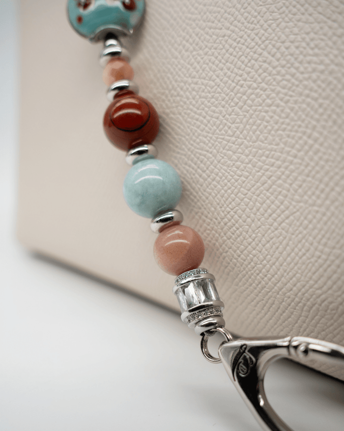 LD Keyfinder Maple Majesty beaded accessory featuring red jasper, jade, and artisan glass beads with platinum accents.