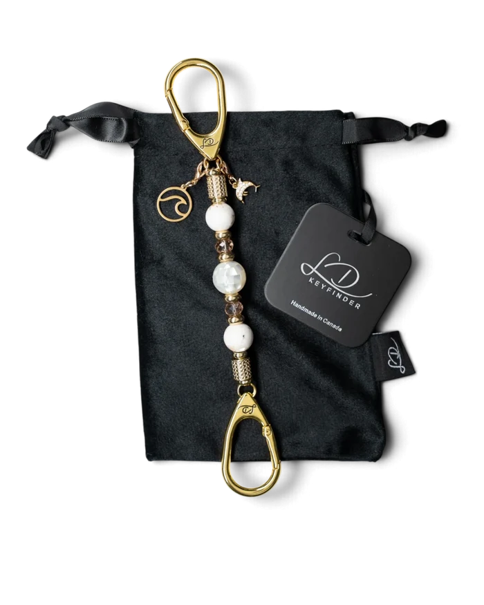 LD Keyfinder Mediterranean Glow-Mini featuring Mother of Pearl, ivory seashell beads, gold charms, and velvet pouch.