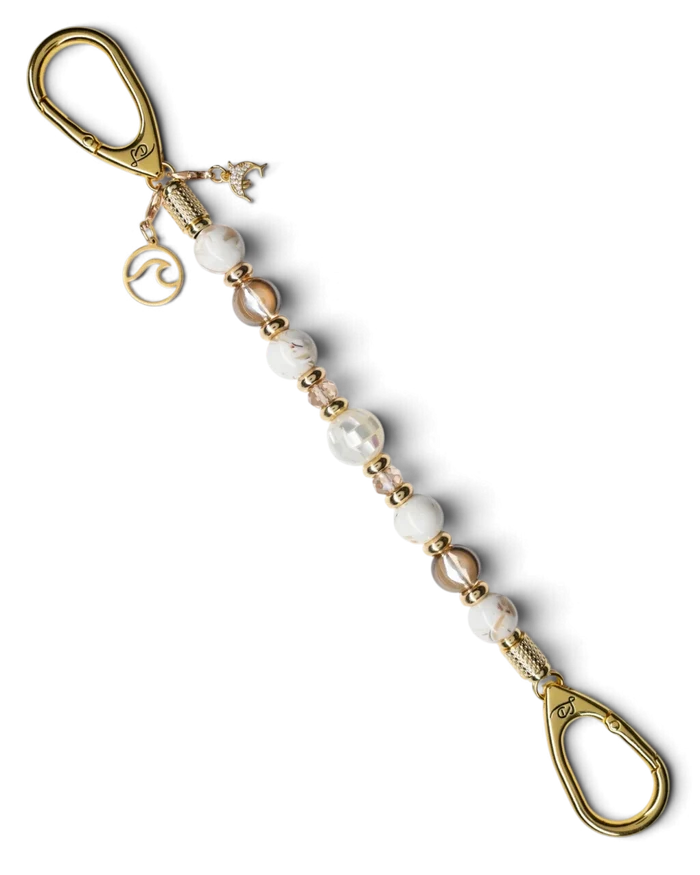LD Keyfinder Mediterranean Glow beaded key holder with Mother of Pearl, ivory shells, gold beads, and ocean charms.