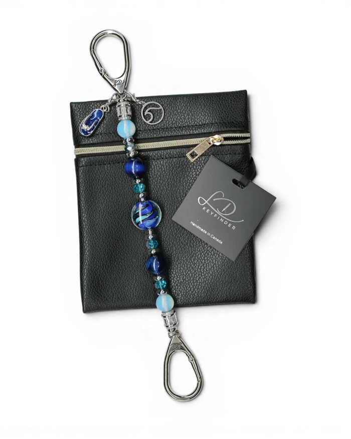 LD Keyfinder Ocean Mosaic beaded keychain with blue tiger eye, opalite, and artisan glass beads on a black pouch.