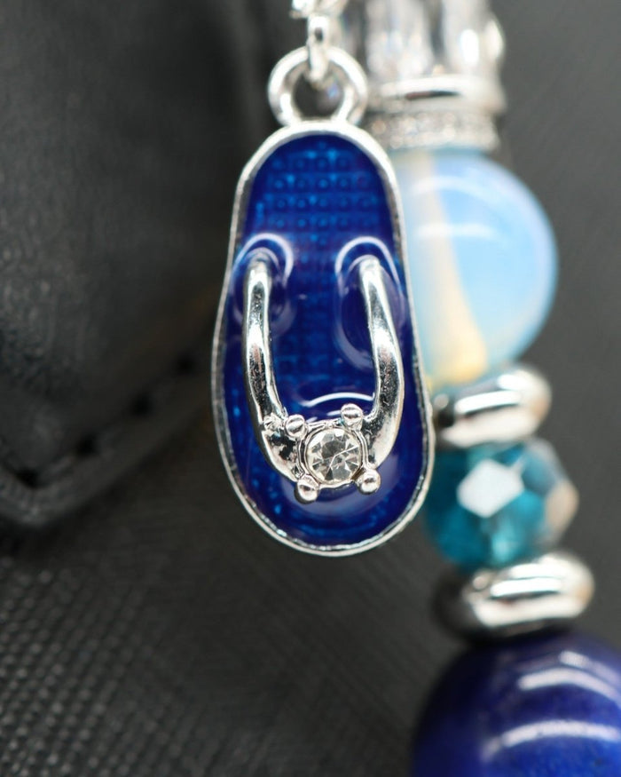 LD Keyfinder Ocean Mosaic accessory featuring a blue enamel flip-flop charm with a rhinestone, opalite, and blue beads.