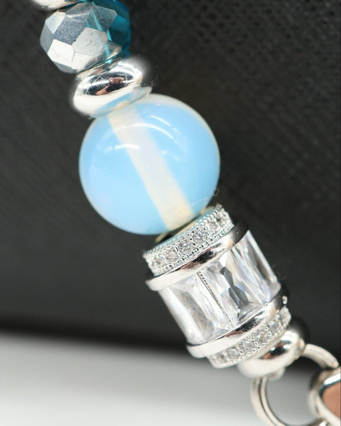 LD Keyfinder Ocean Mosaic beaded accessory featuring a handcrafted blue glass bead, opalite, and baguette rhinestone.
