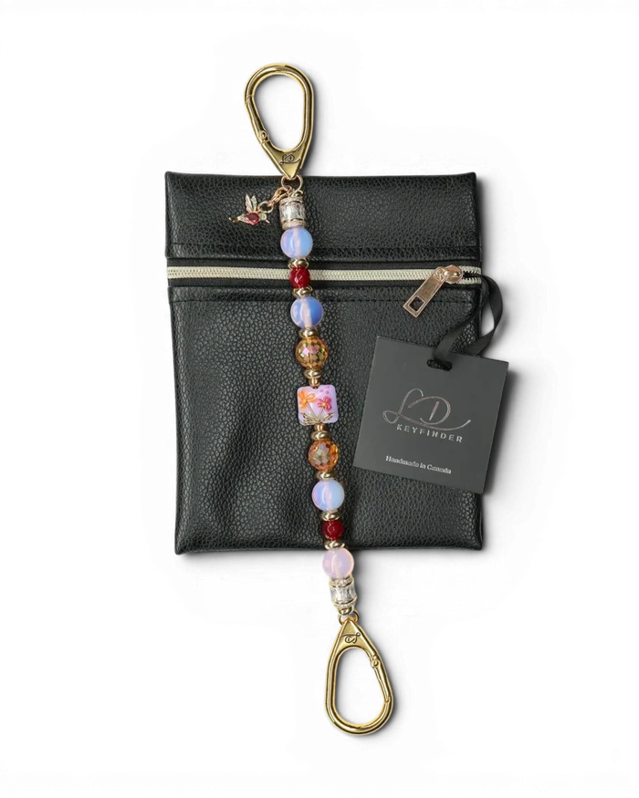 LD Keyfinder Opalite Bloom keychain with pink opalite, ruby red, and burnt orange etched glass beads, featuring a floral lampwork bead and hummingbird charm.
