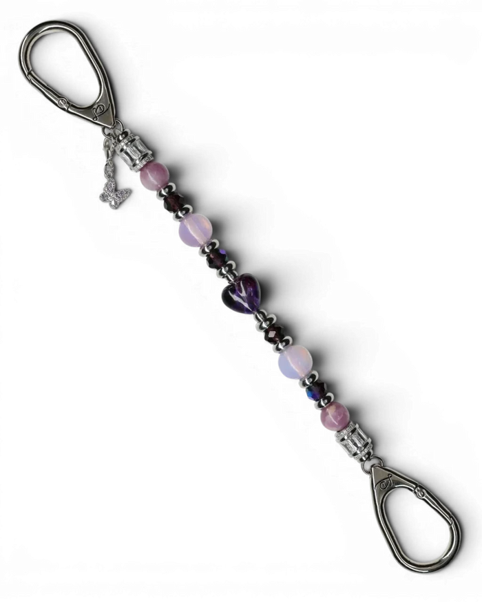 LD Keyfinder Orchid Flutter beaded accessory with lepidolite, opalite, glass beads, and a purple butterfly charm.