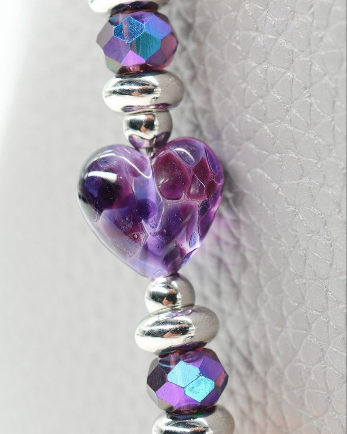 LD Keyfinder Orchid Flutter beaded accessory featuring a handcrafted purple glass heart, lepidolite, opalite, and crystals.