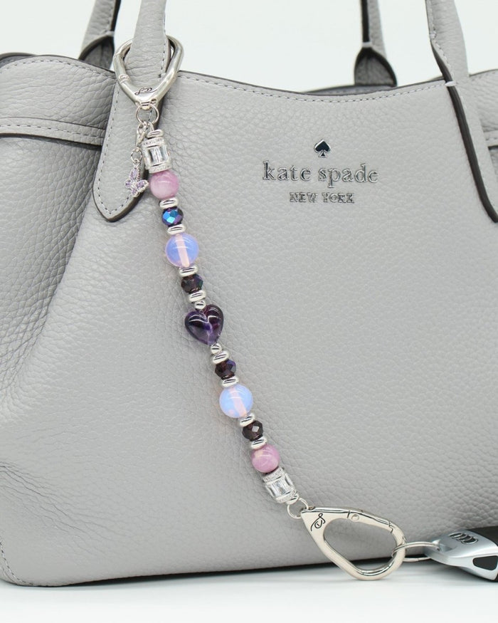 LD Keyfinder Orchid Flutter beaded accessory with lepidolite, opalite, and glass beads, featuring a butterfly charm.