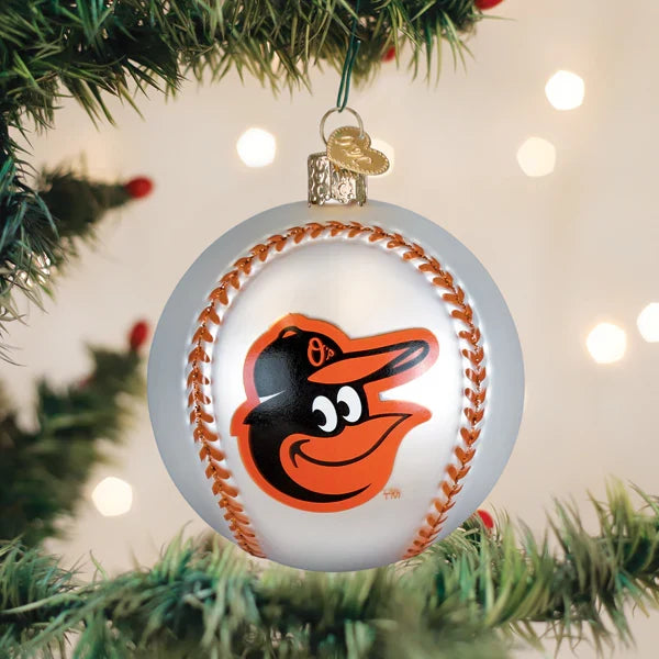 Baseball-shaped ornament with a Orioles logo on a Christmas tree