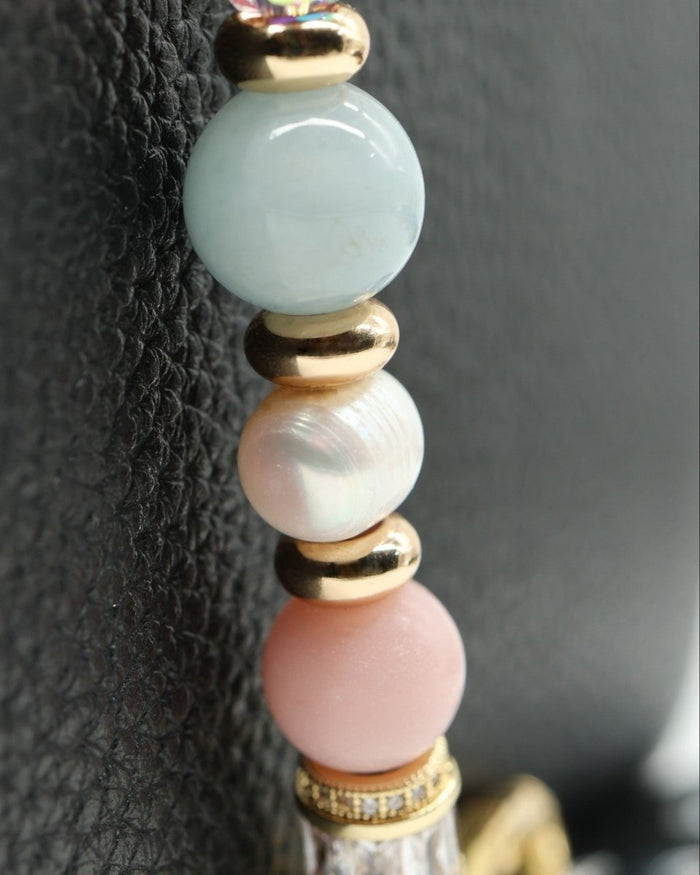 LD Keyfinder Pastel Garden bracelet with pink opal, freshwater pearls, aquamarine beads, and gold accents.