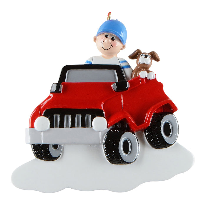 Decorative ornament of a boy driving a red off road vehicle with a dog on a white background