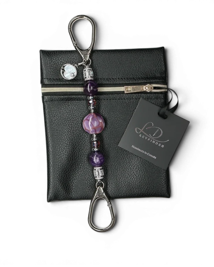 LD Keyfinder Petite Amethyst Moon keychain with amethyst, glass beads, and moon charm on black pouch.