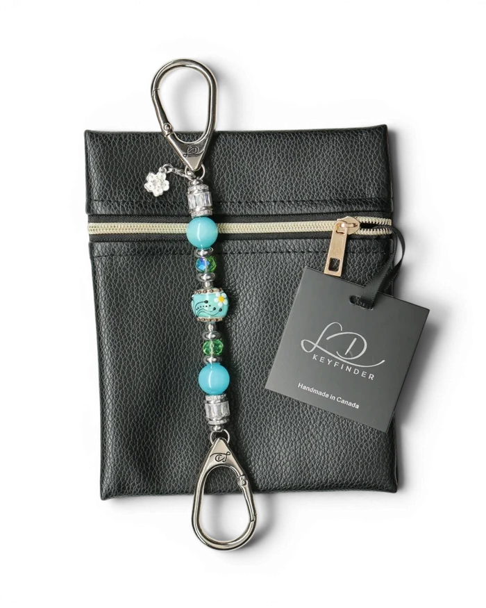 LD Keyfinder Petite Azure Meadow keychain with aqua blue cat's eye beads, green faceted glass beads, and a handcrafted lampwork glass daisy bead.