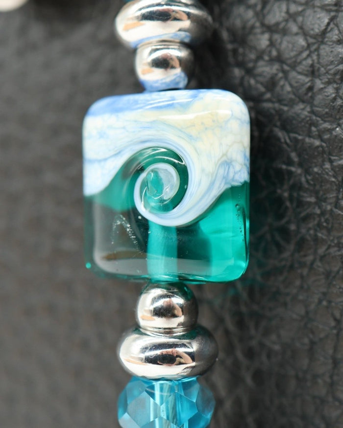 LD Keyfinder Petite Beachy Dreams bracelet with teal, blue, and white glass bead, larimar beads, and silver spacers.