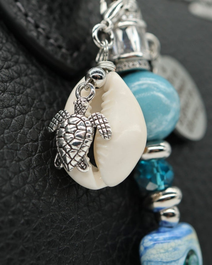 LD Keyfinder Petite Beachy Dreams charm bracelet with turtle, seashell, blue beads, and glass bead.
