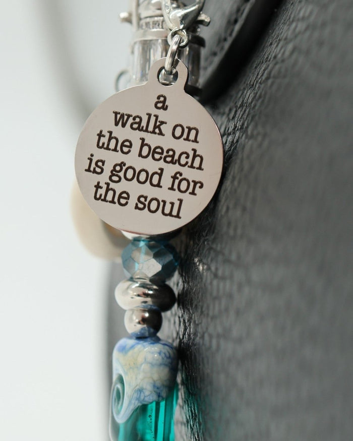 LD Keyfinder Petite Beachy Dreams keychain with a round charm reading "a walk on the beach is good for the soul."