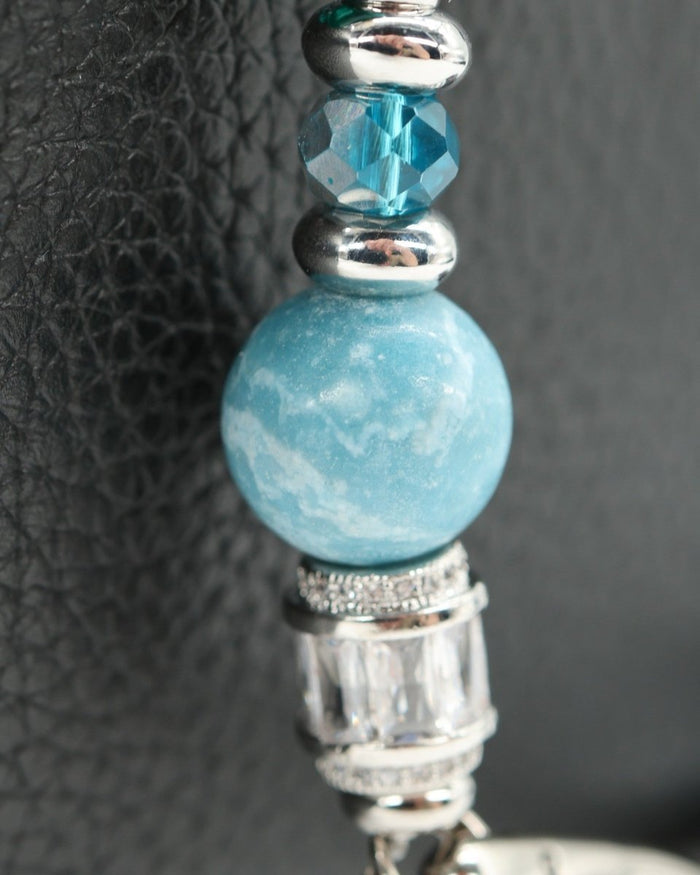 LD Keyfinder Petite Beachy Dreams bracelet with teal, blue, and white beads, silver spacers, and a turtle charm.