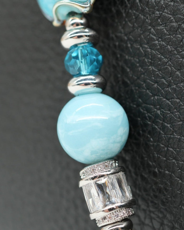 LD Keyfinder Petite Celestial Tide bracelet with turquoise, aqua, and silver beads, platinum-plated accents, and star charm.