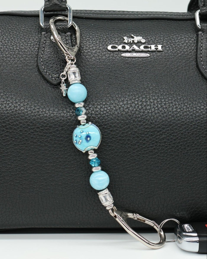 LD Keyfinder Petite Celestial Tide keychain with turquoise, aqua, and silver beads and a star charm.