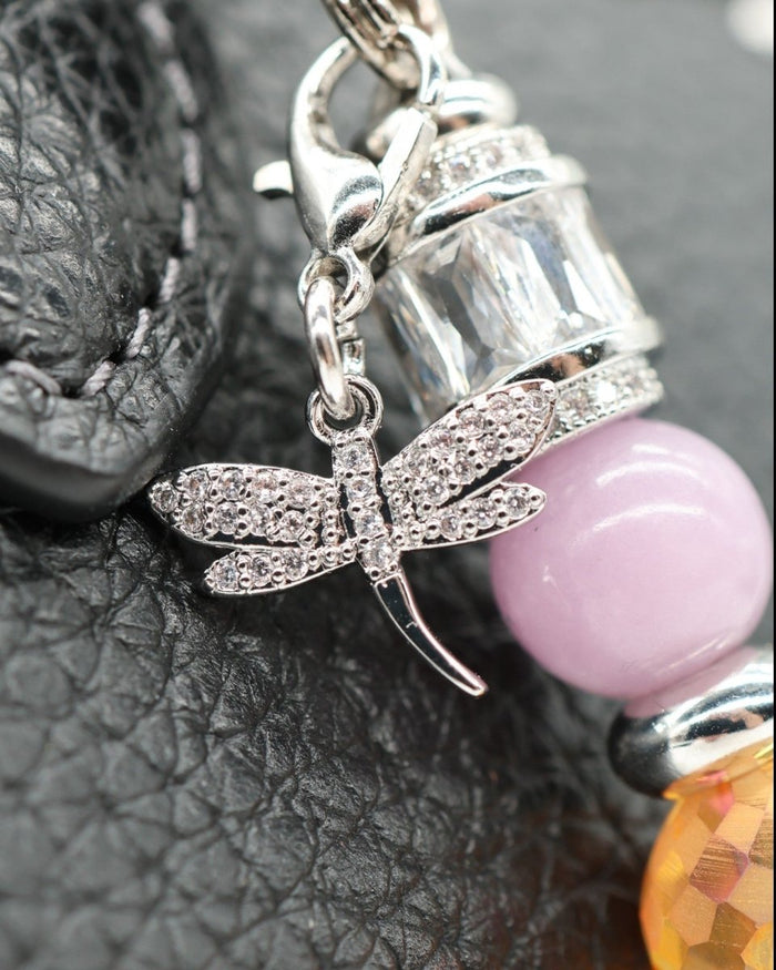 LD Keyfinder Petite Dragonfly Magic charm with purple lepidolite, orange faceted glass, and rhinestone dragonfly.