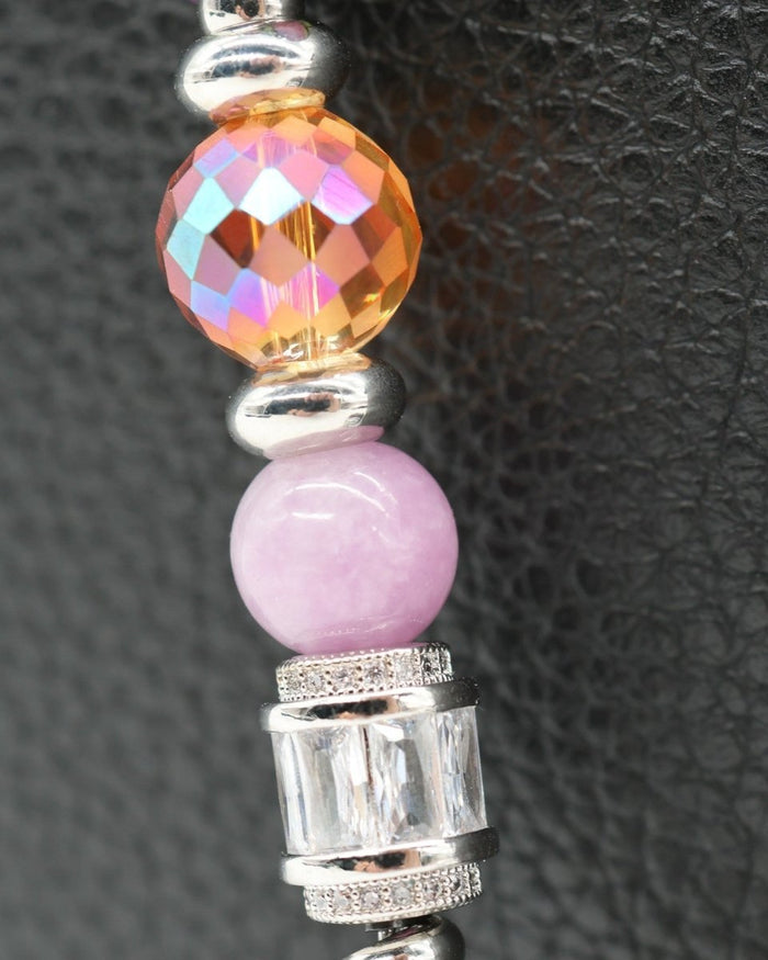 LD Keyfinder Petite Dragonfly Magic bracelet with purple lepidolite, orange faceted glass, and rhinestone dragonfly charm.